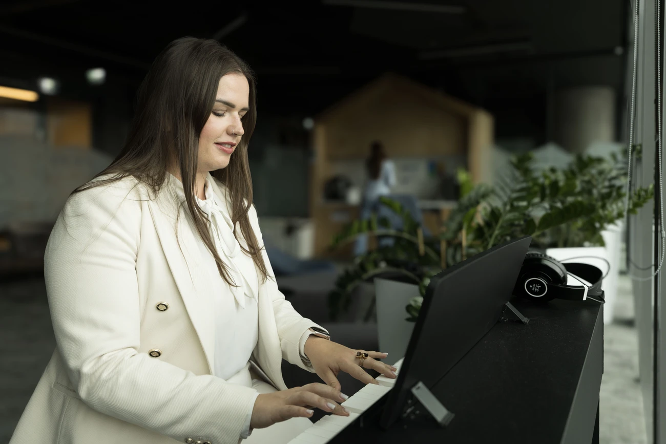 Employee in the office playing on the piano
