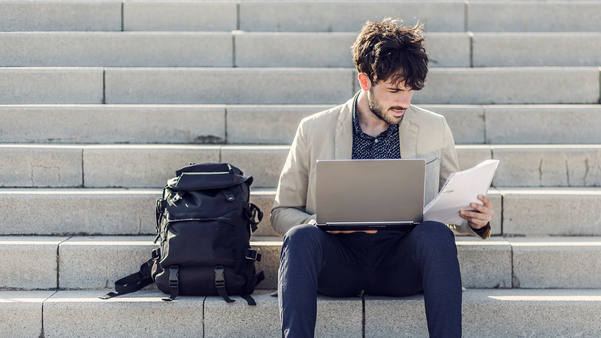 man-looking-at-papers