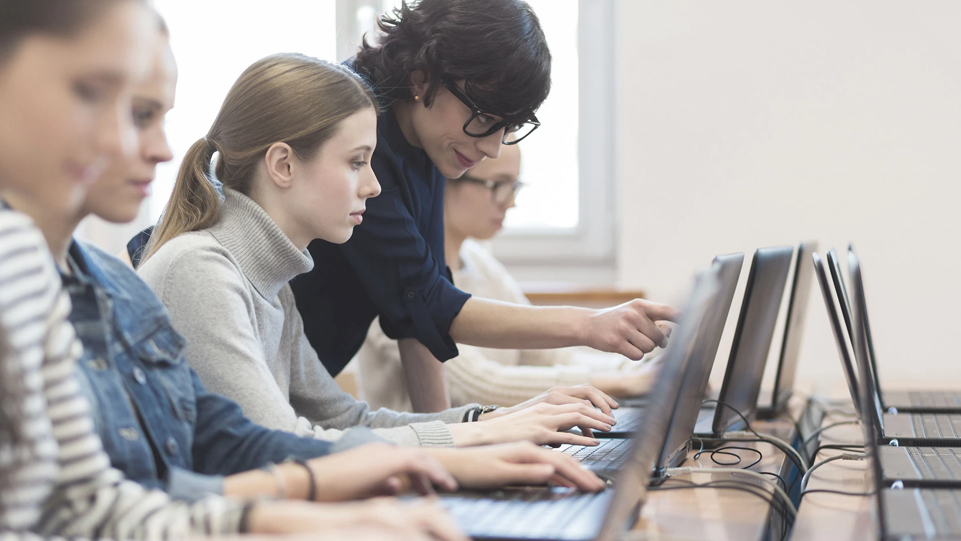 Female students learning programming