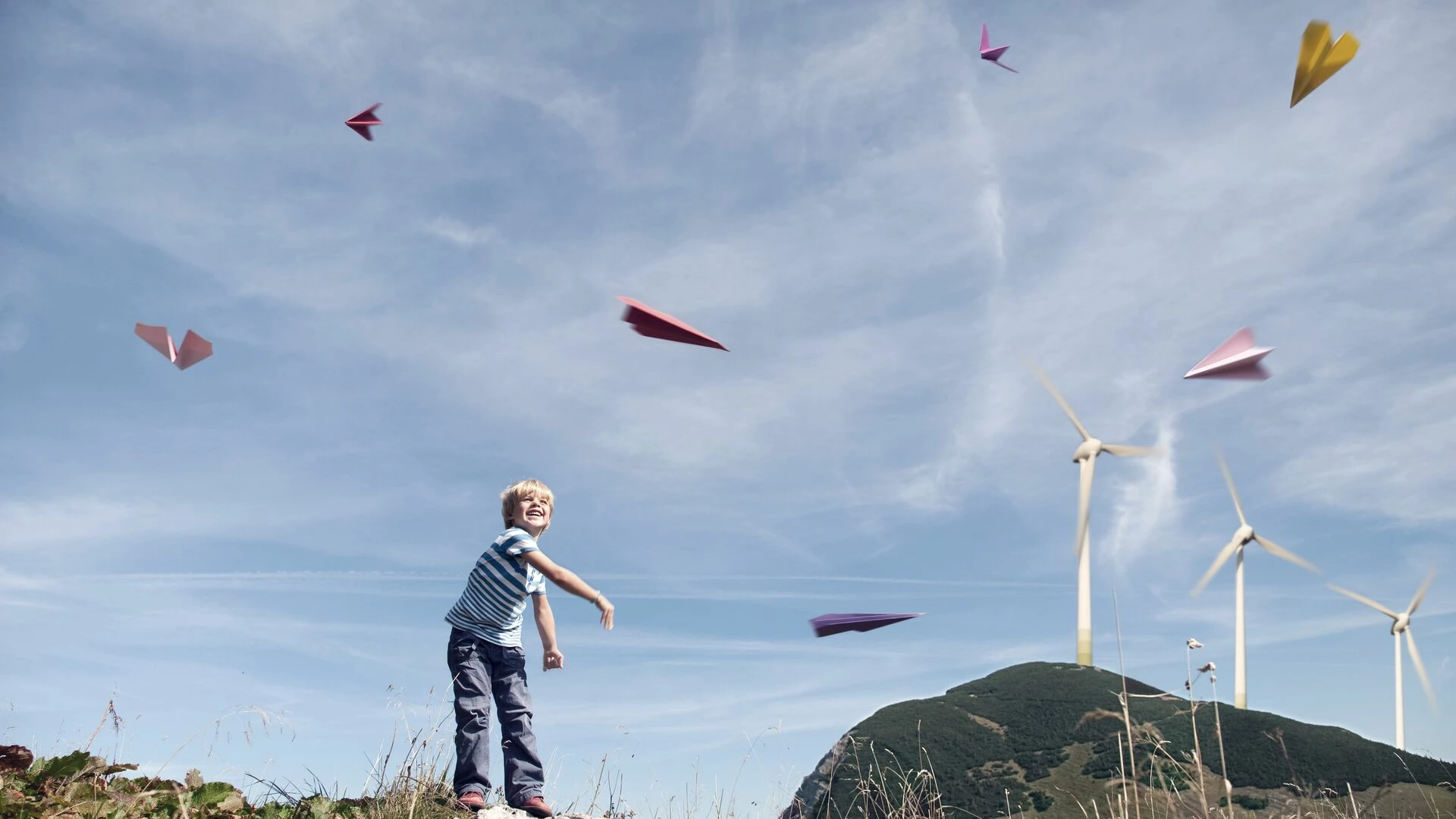 boy-playing-with-paper-planes