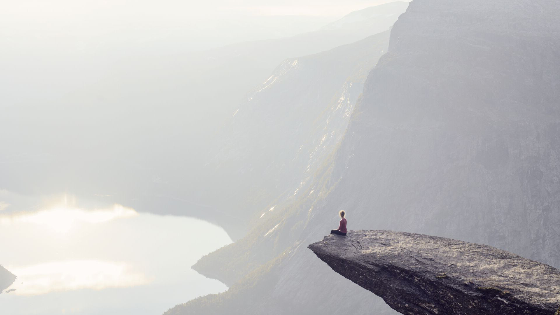 woman-sitting-on-the-edge-of-a-cliff-flipped.