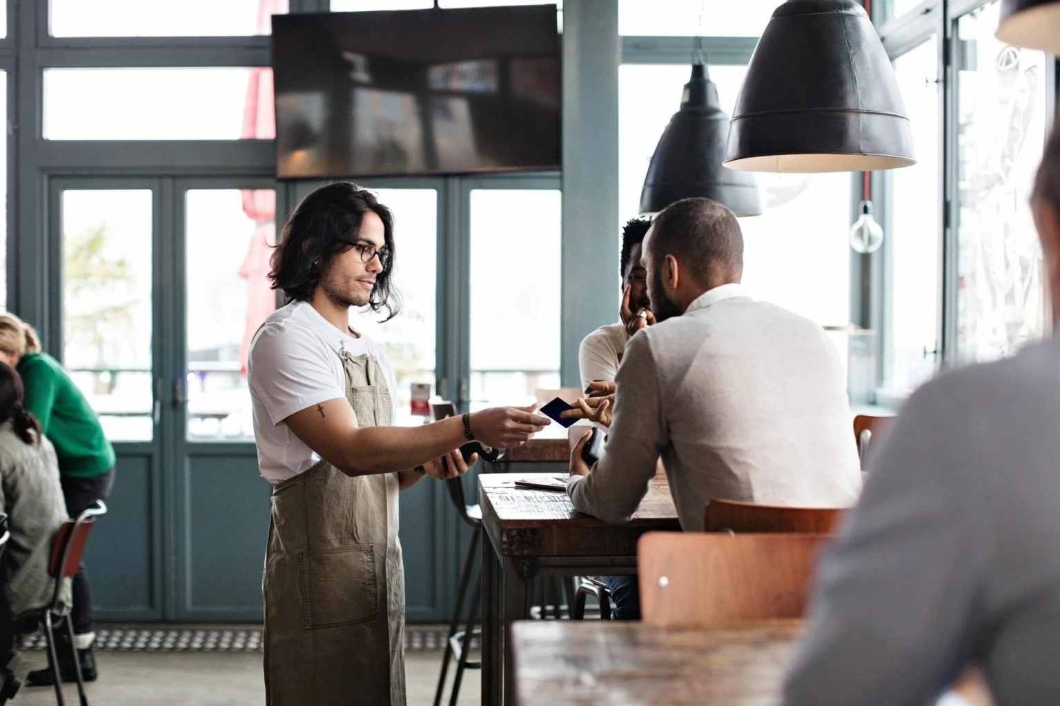Making payments at restaurant