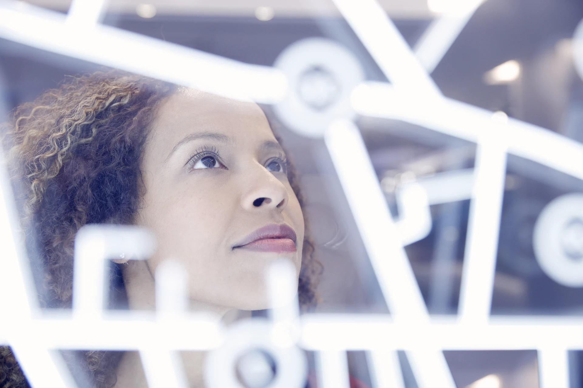 Woman operating digital interface technology
