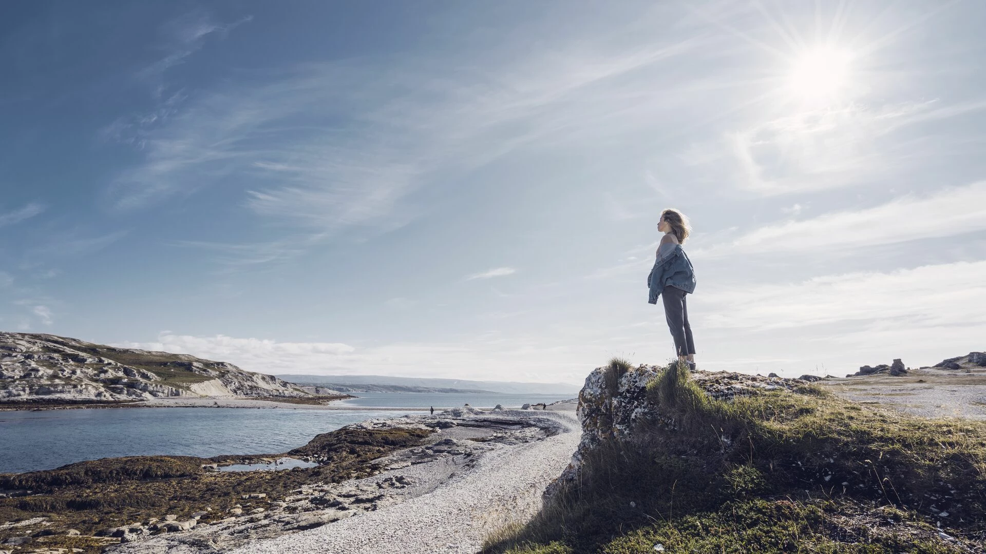 Woman standing at the coast