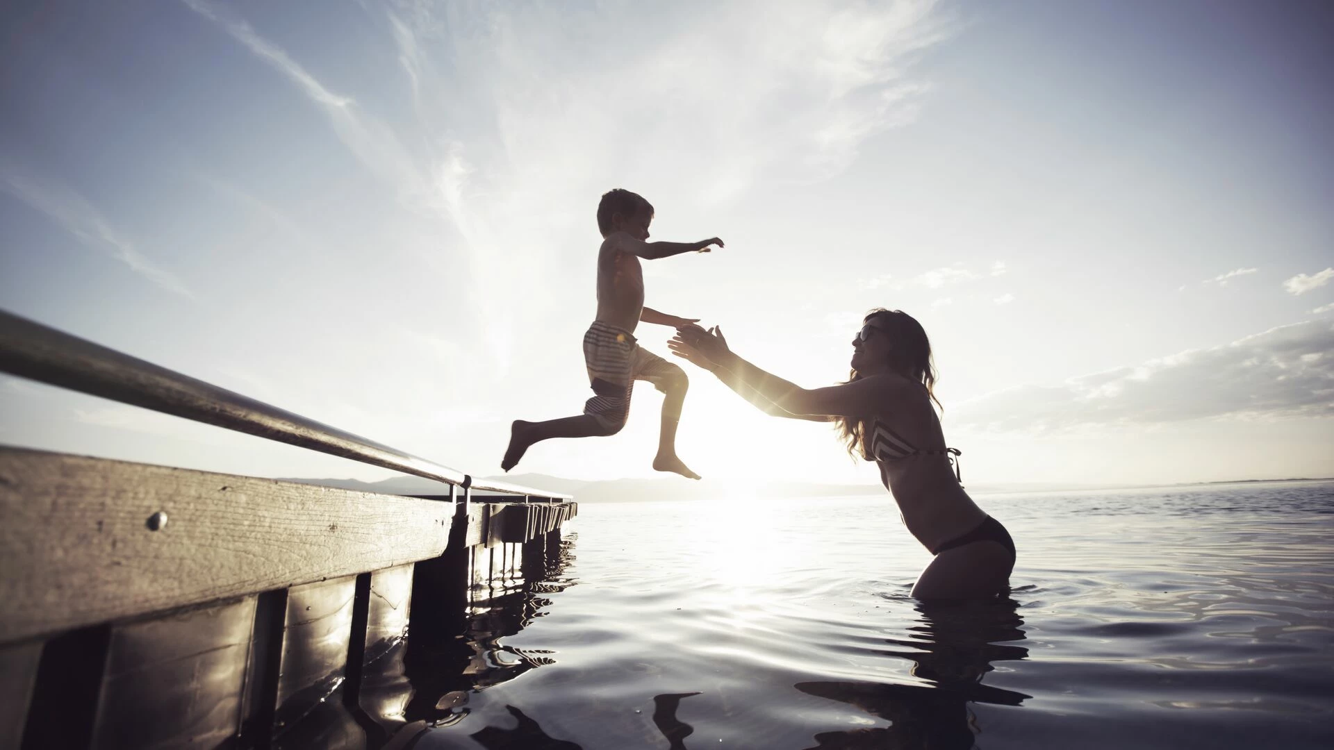 Mother and son playing in lake