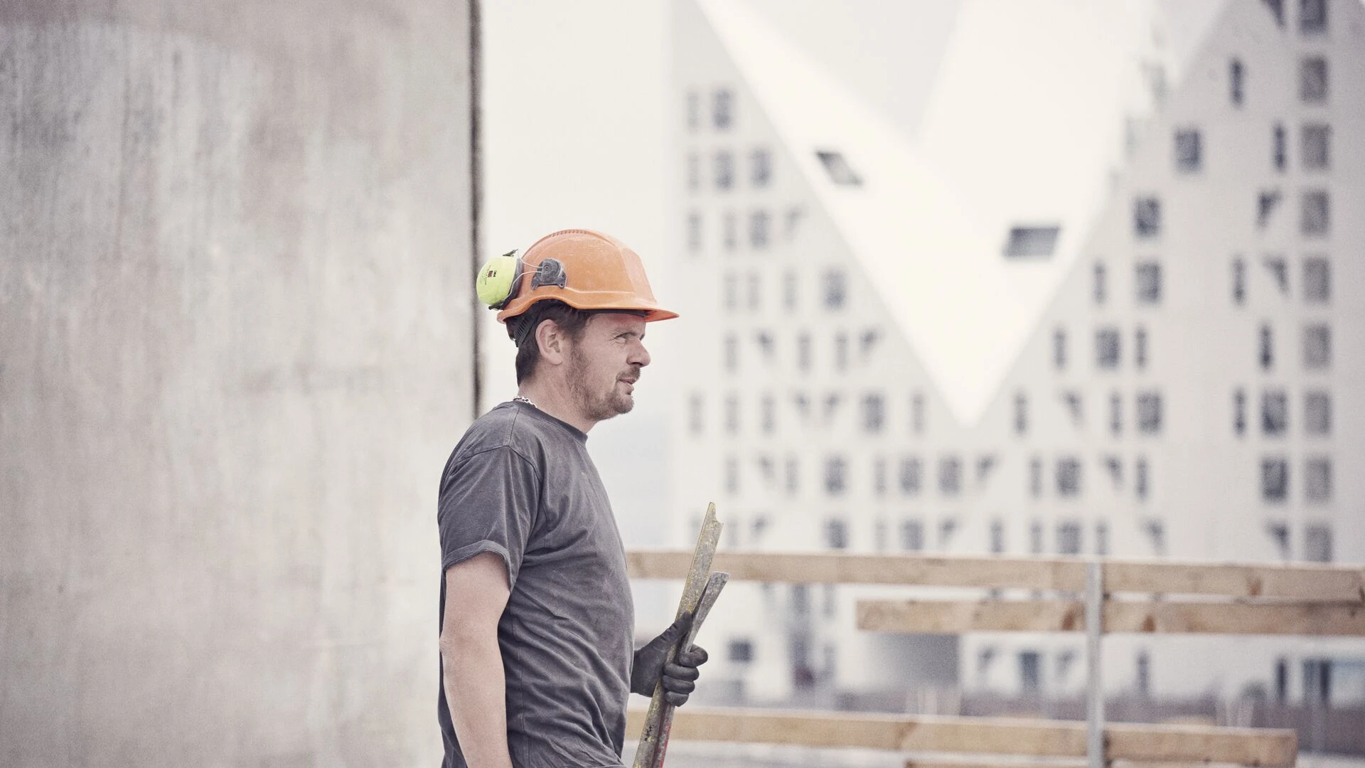 crafts-man-with-helmet-on-building-site.jpg