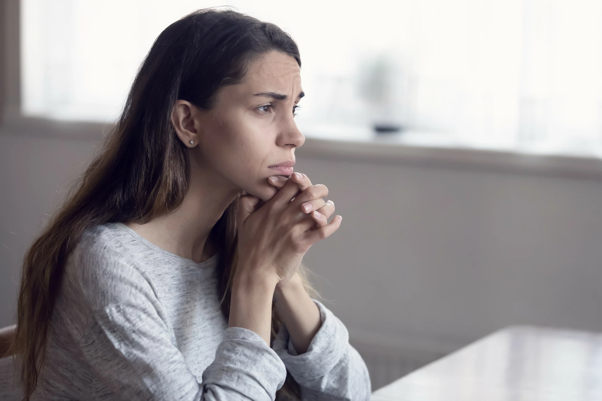 Young woman looks into the distance.