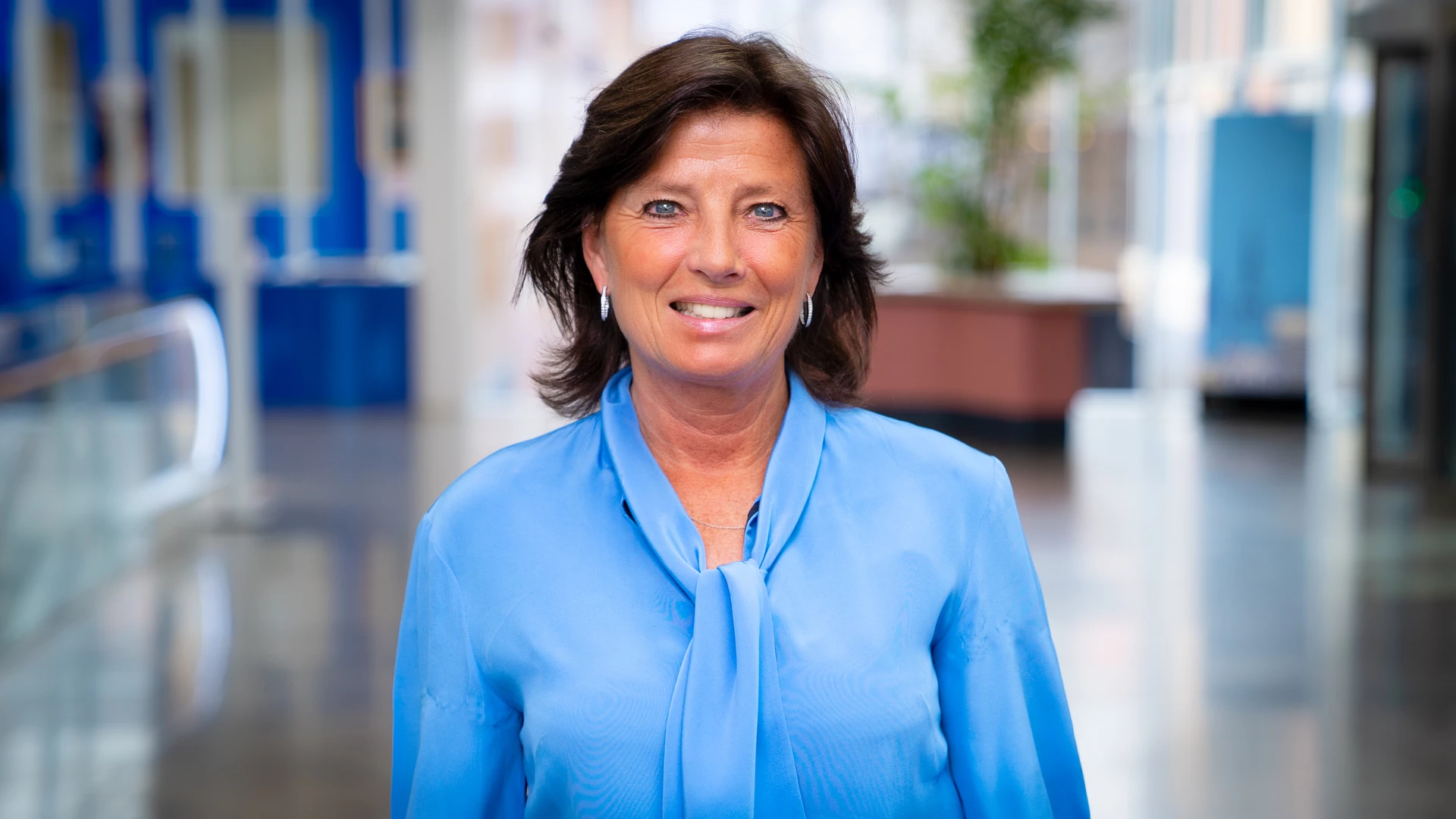 Smiling woman in a blue blouse