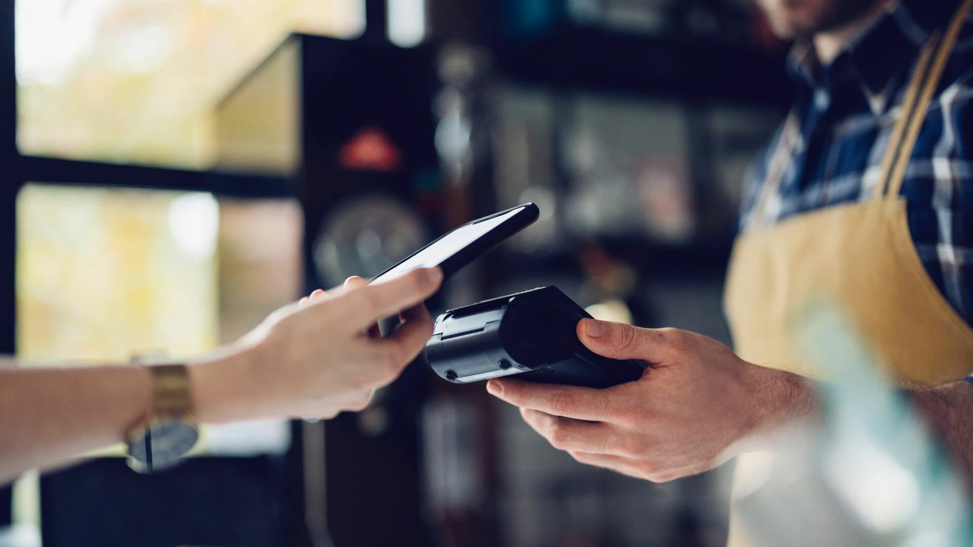 Person paying with cell phone
