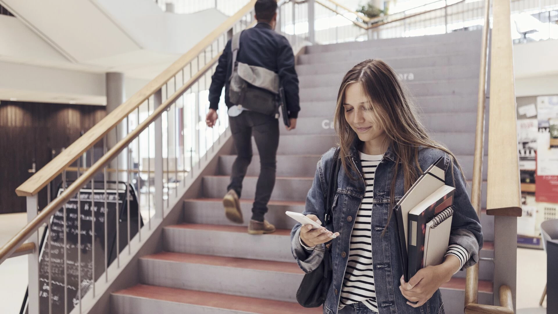 university-student-checking-phone