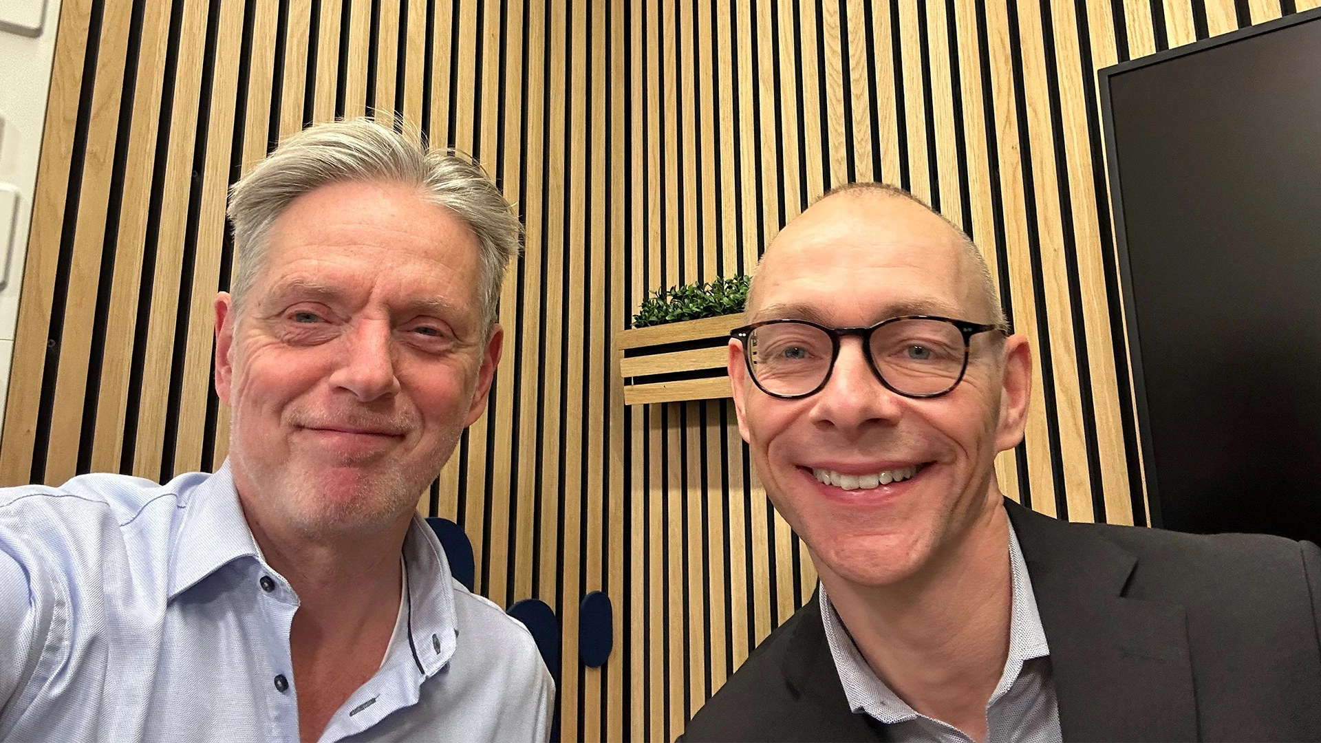Helge J. Pedersen and Michael Borre in a podcast studio