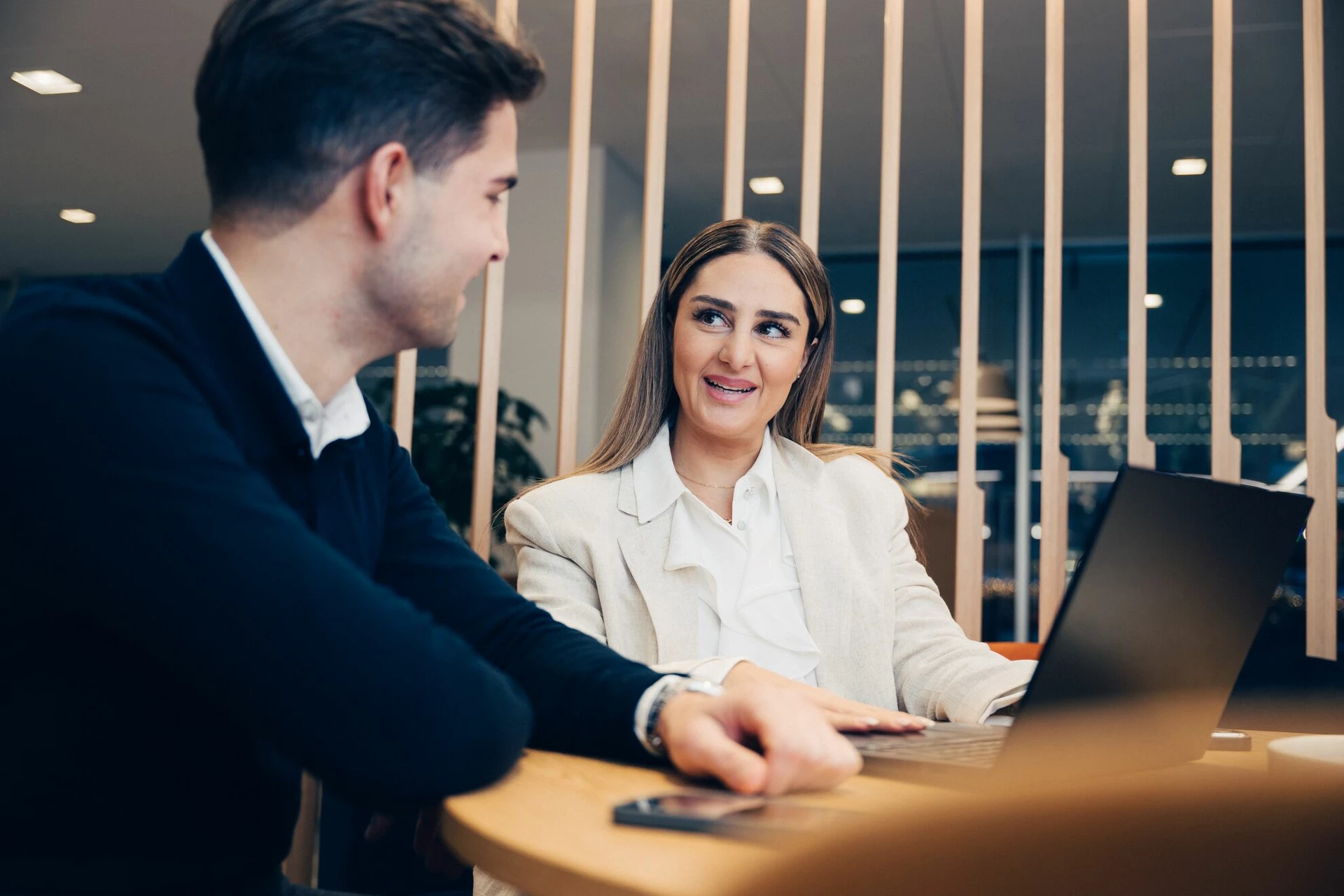 Two employees working at the office
