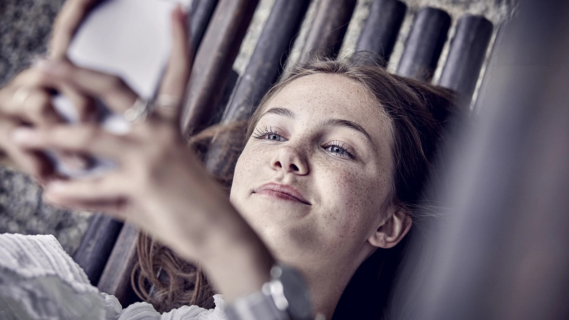 Young woman looking at phone