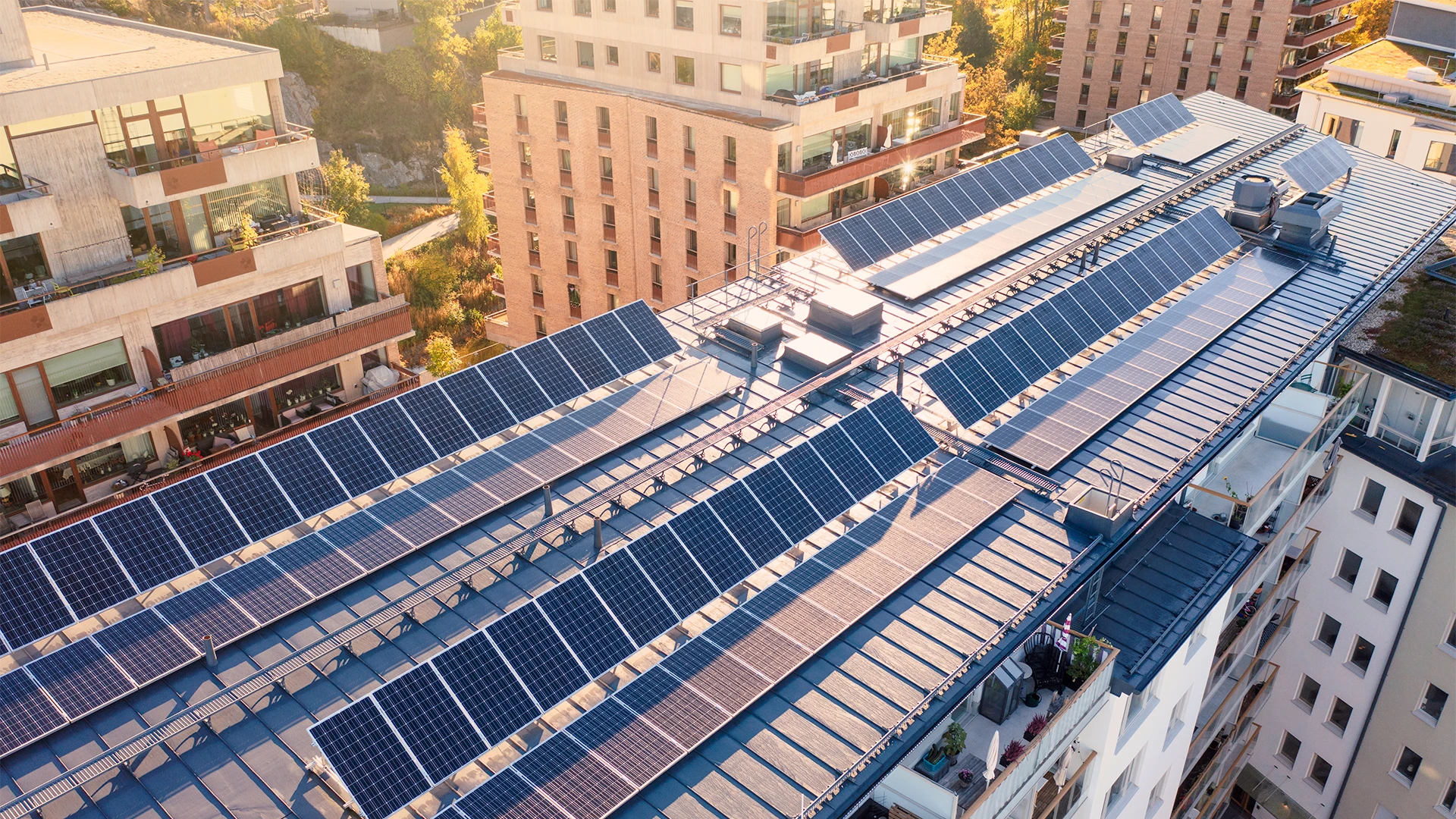 Solar panels on the roof of an apartment building in Stockholm, Sweden