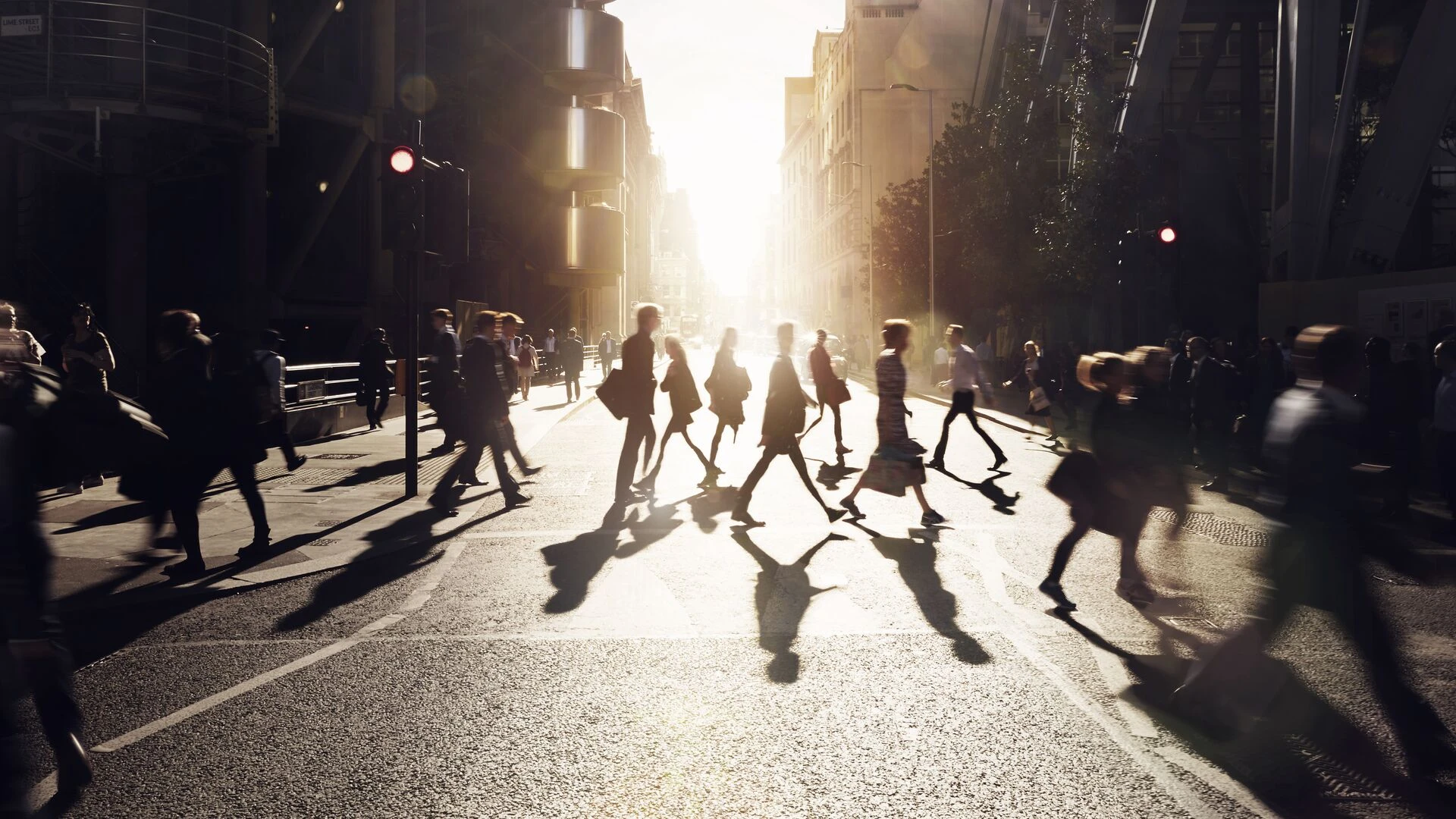 Business people walking through at city at dawn