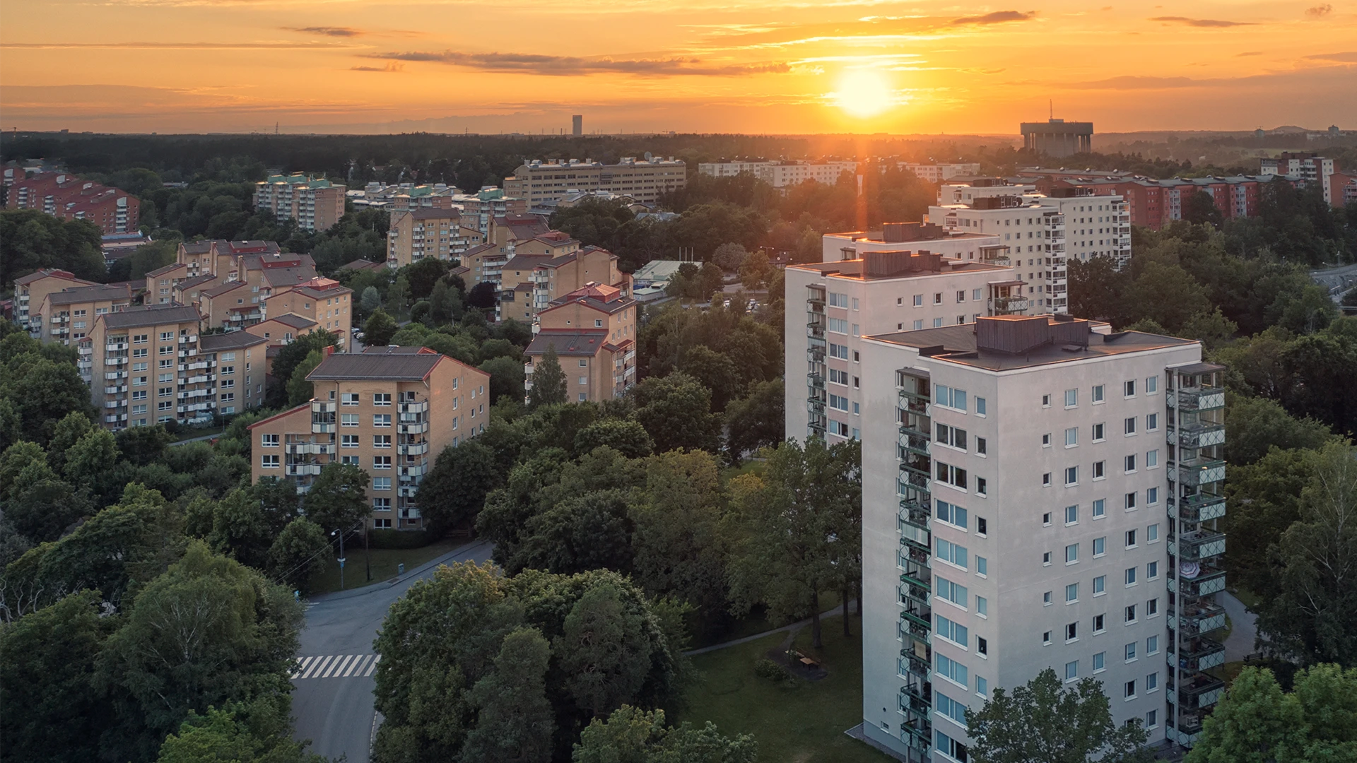 Aerial view of apartment buildings at sunset