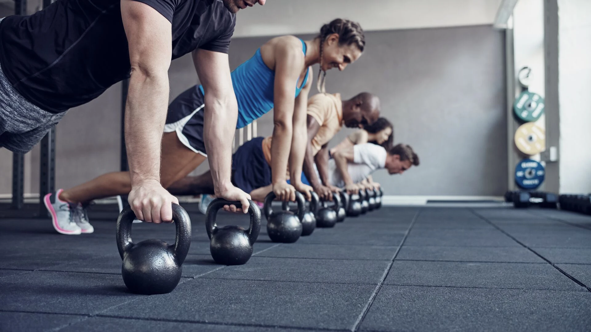 people-doing-pushups-together-in-a-health-club-class