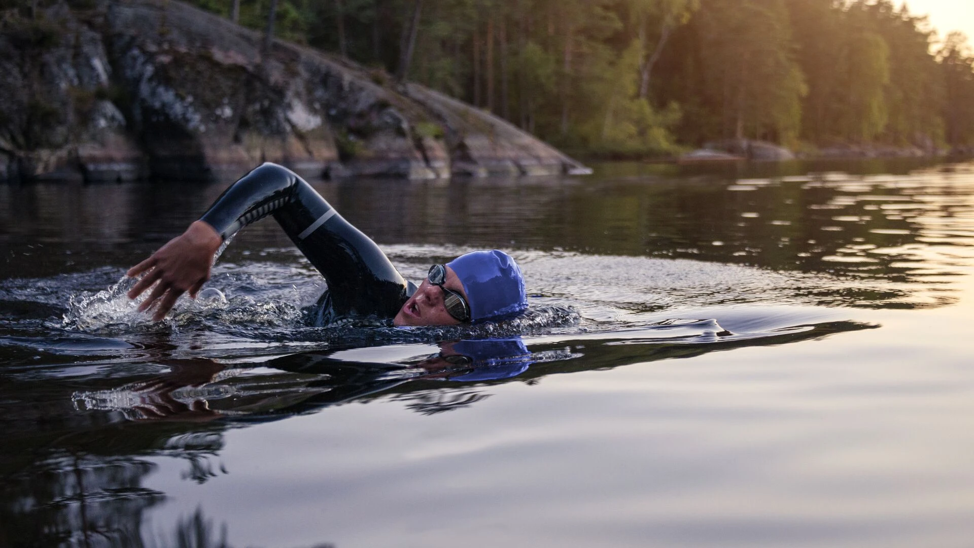 sports-person-swimming-with-heads-out-of-the-water-on-lake