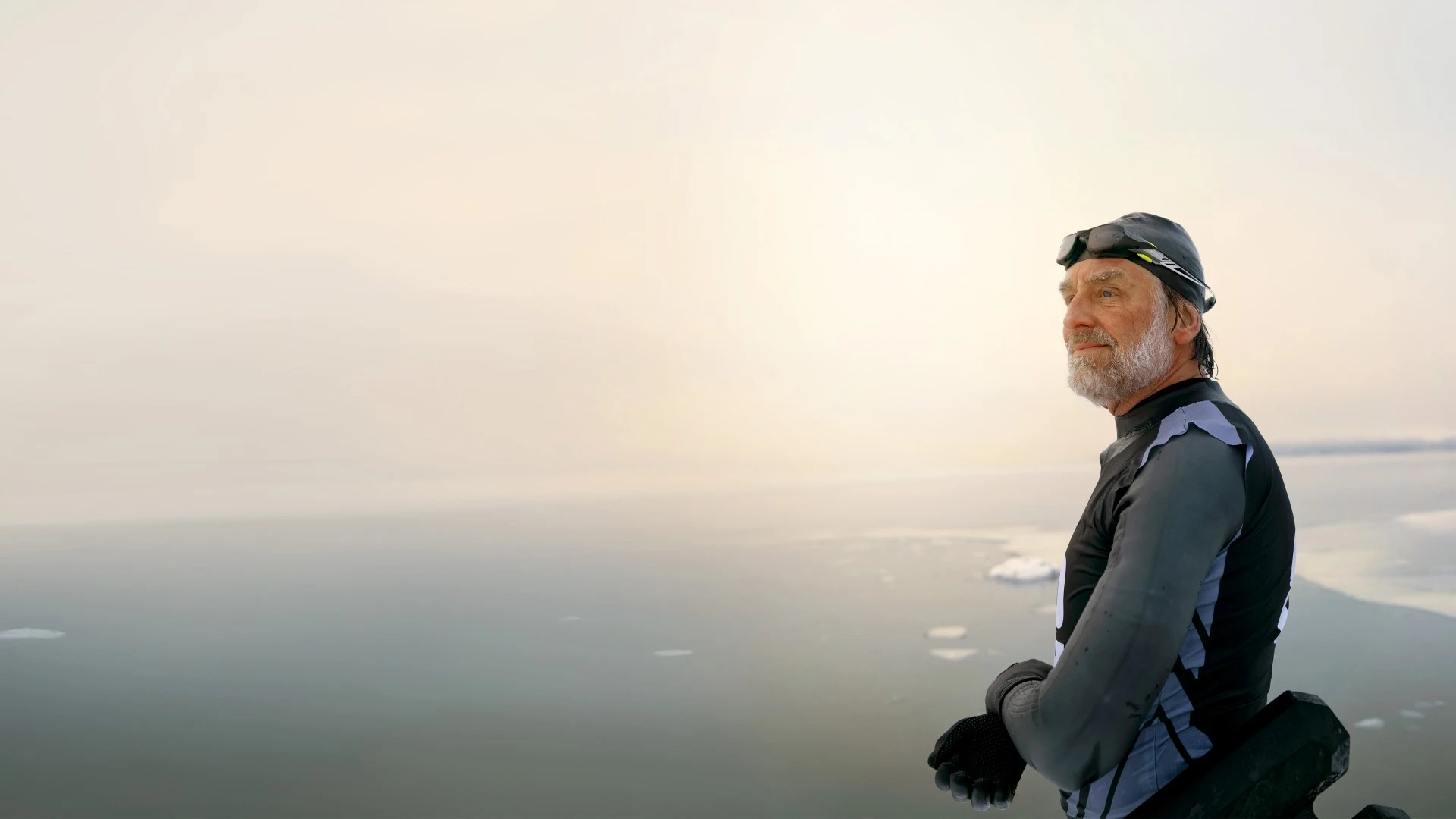 /Swimmer%20standing%20by%20icy%20lake..