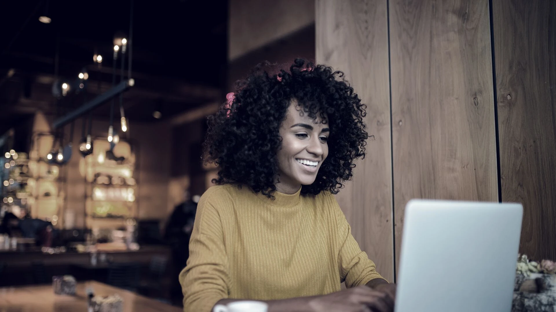 Smiling woman using laptop