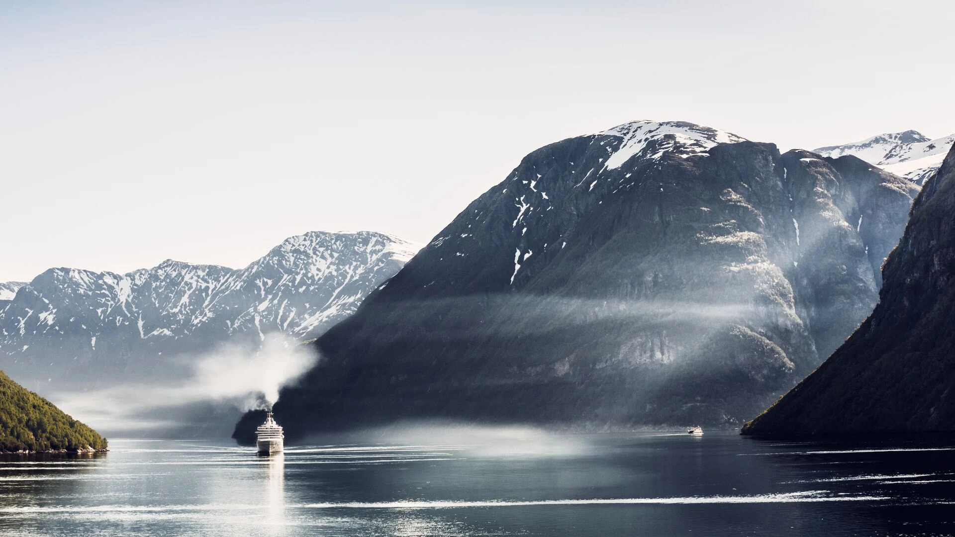 Cruise boat passing a fjord in Norway