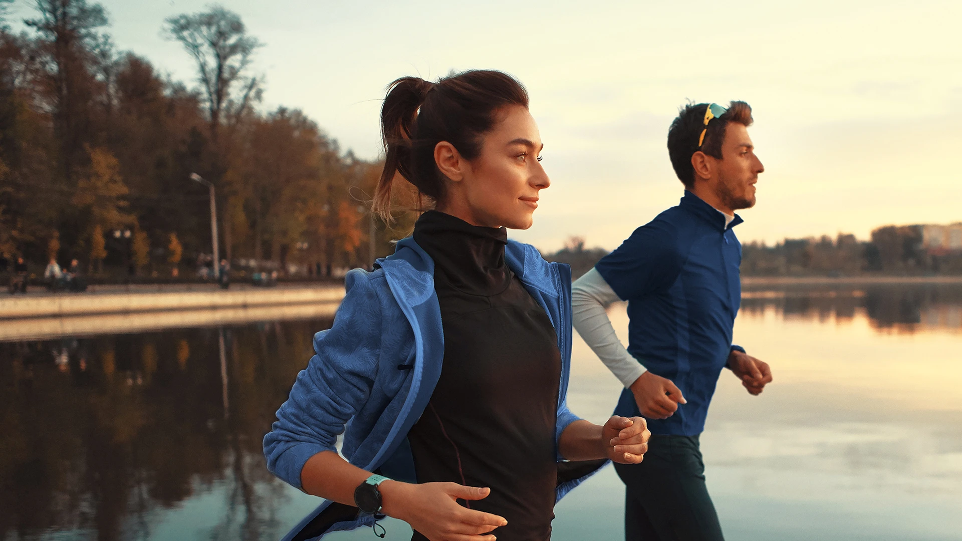 /A%20couple%20running%20in%20sunset.%20.