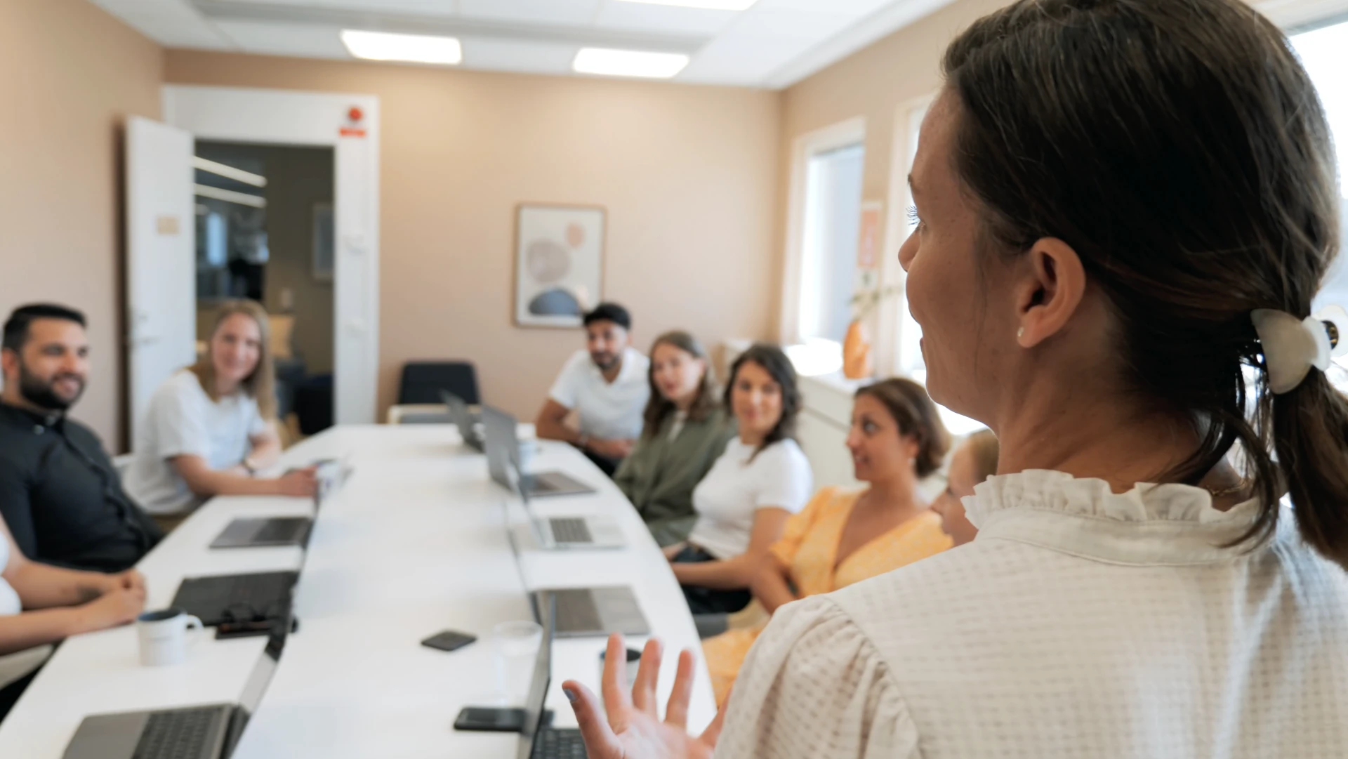 Group sitting at a desk discussing. 