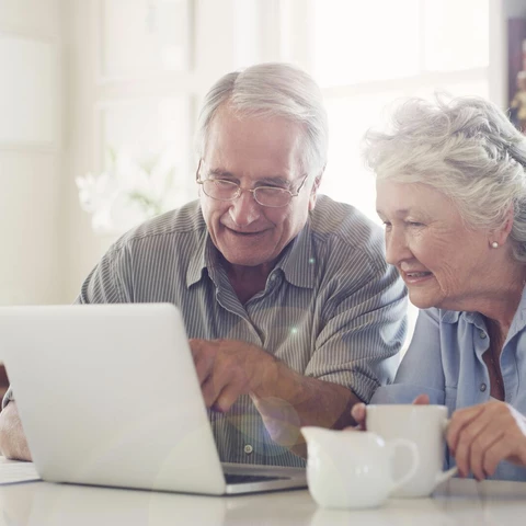 senior-couple-using-a-laptop-together-at-home