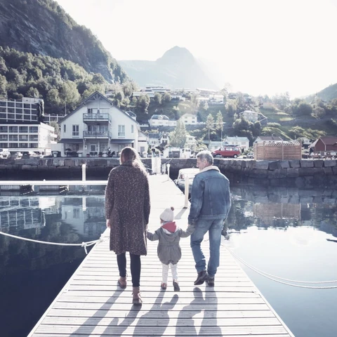 Family walking on pier