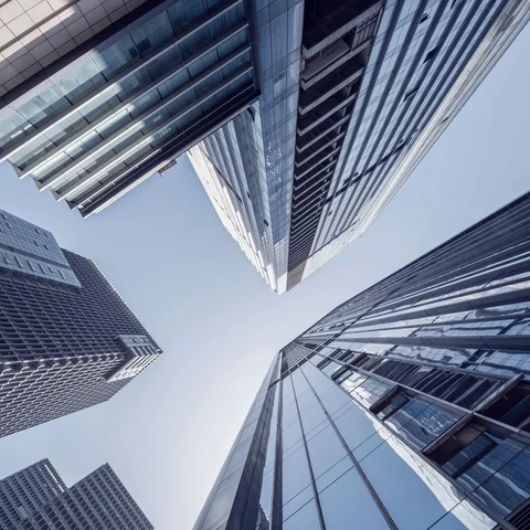 Modern skyscrapers against blue sky low angle view.