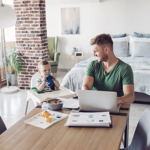 Father and baby in living room