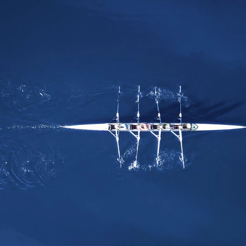 Rowing boat surrounded by classic blue water