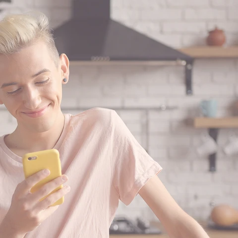 boy looking at phone - RESTRICTED USE