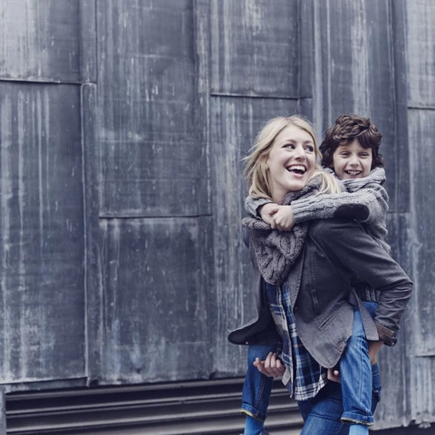 Woman carrying child 