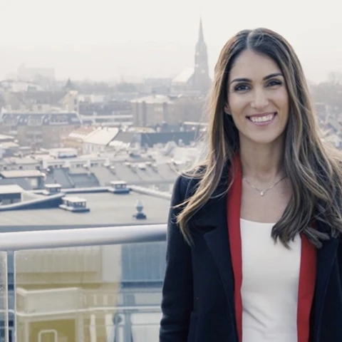 Derya Incedursun, Private Economist, standing on balcony
