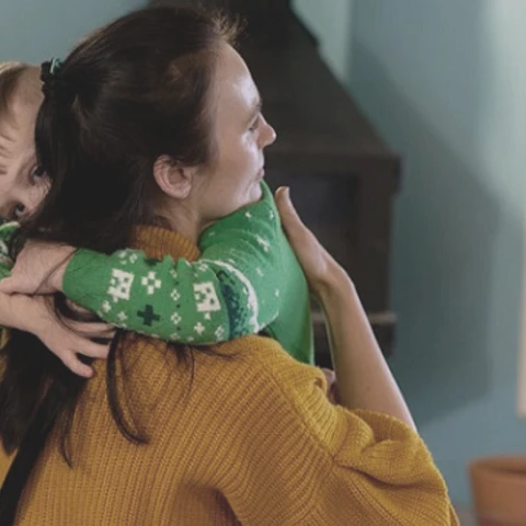 Mom and son hugging 