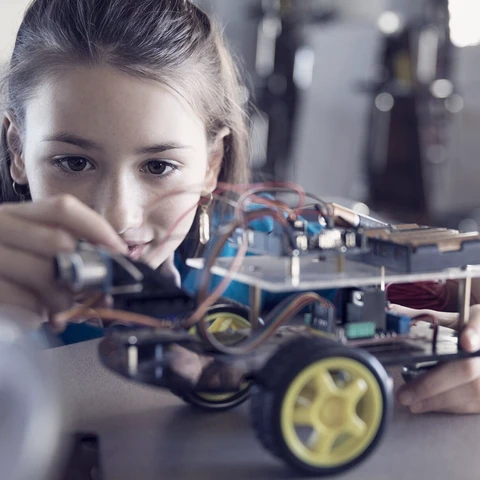 Young girl building