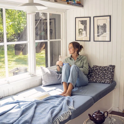 Young woman relaxing in her summer house