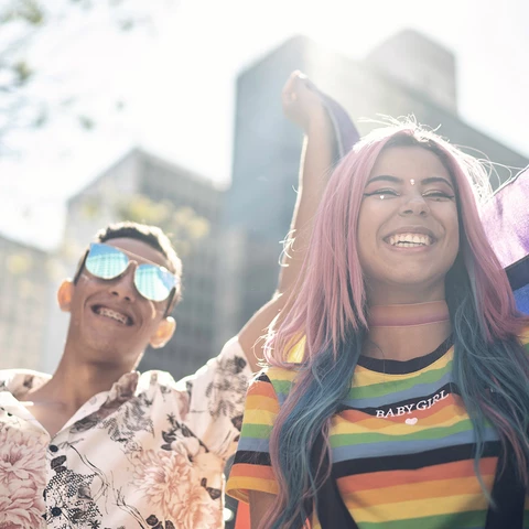 Two friends enjoying Pride parade