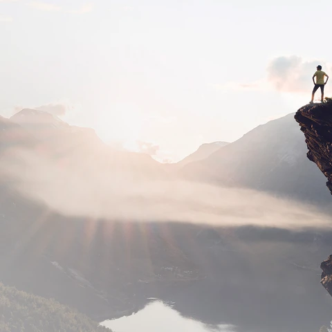 success-man-standing-on-mountai