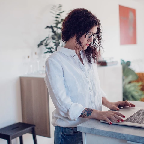 Woman using laptop at home