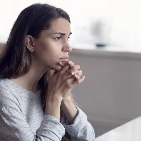Young woman looks into the distance.