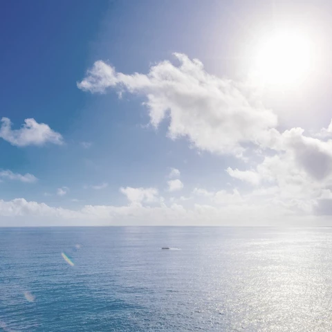 Calm ocean under blue sky