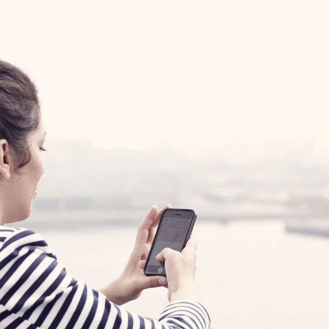 Young woman looking at phone