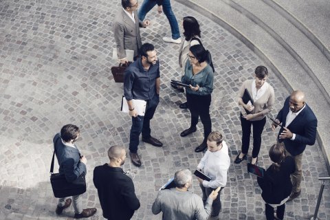 male and female colleagues standing outdoors