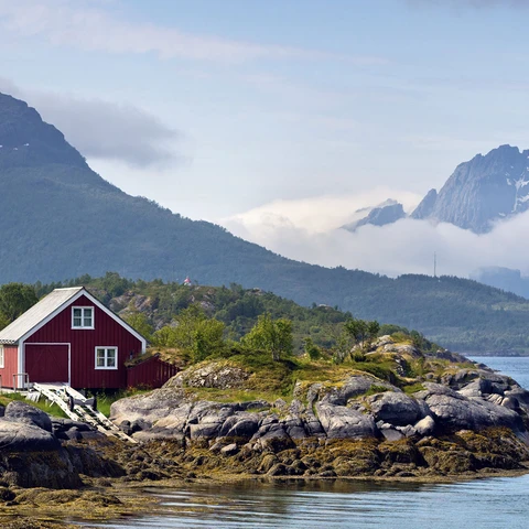 Shoreline-of-Raftsund-strait-with-red-painted-house