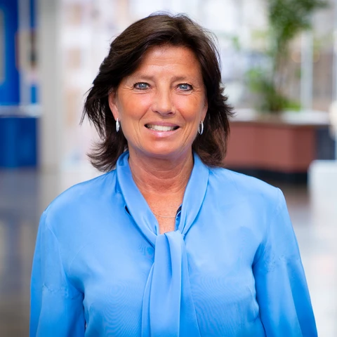 Smiling woman in a blue blouse