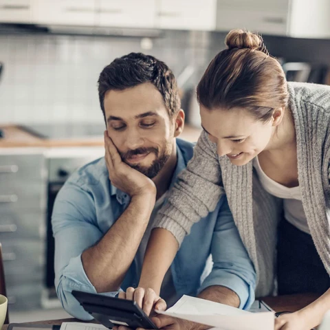 Young couple calculating home finances