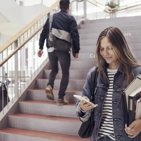 university-student-checking-phone