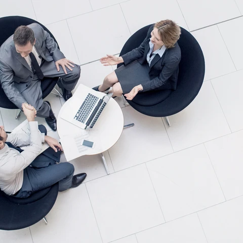 Business meeting with three people